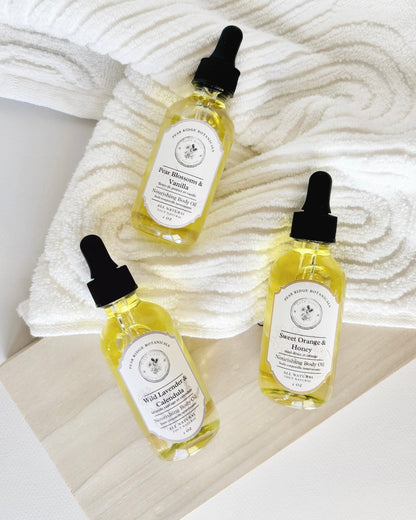 Three bottles of natural skincare products with droppers on a textured white surface.